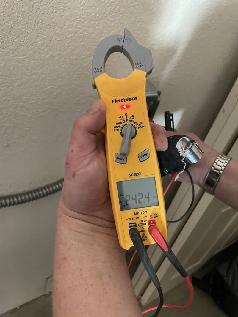 Voltage testing with clamp meter during Hot Tub / Pool Electrical Wiring in Belton